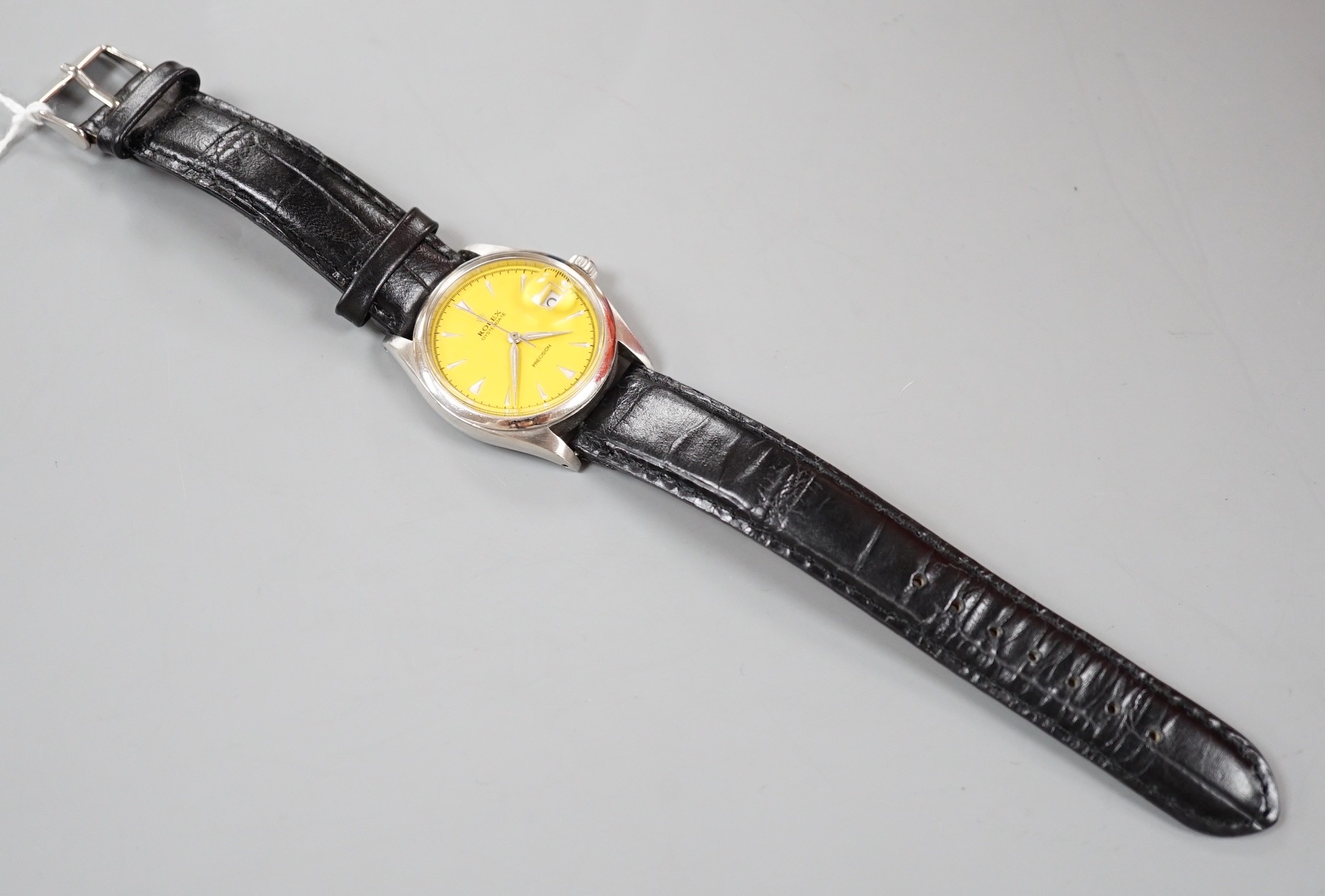 A gentleman's stainless steel Rolex Oysterdate Precision manual wind wrist watch, with later? custom yellow dial, model no. 6294, serial number 959653, on later associated leather strap, case diameter 34mm, no box or pap
